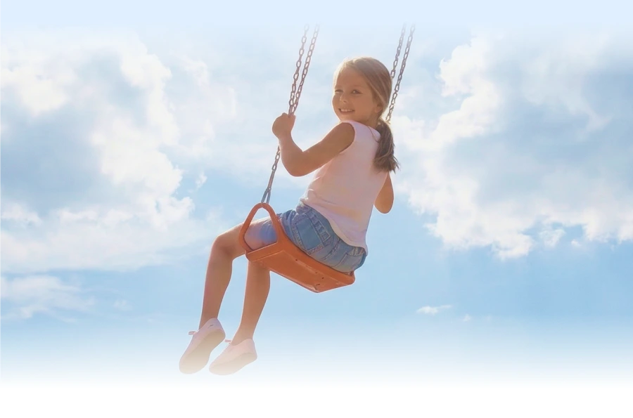 Young girl on swing